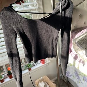 Soft black cropped sweater with open criss cross back